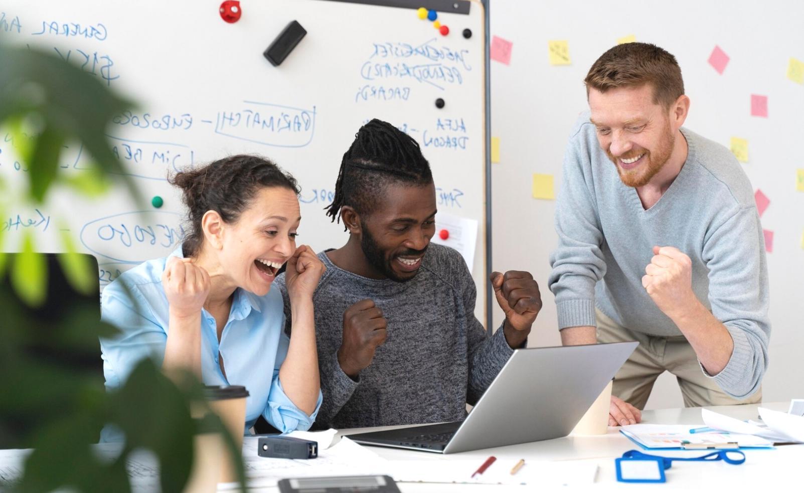 Students collaborating on coding projects during evening workshop session