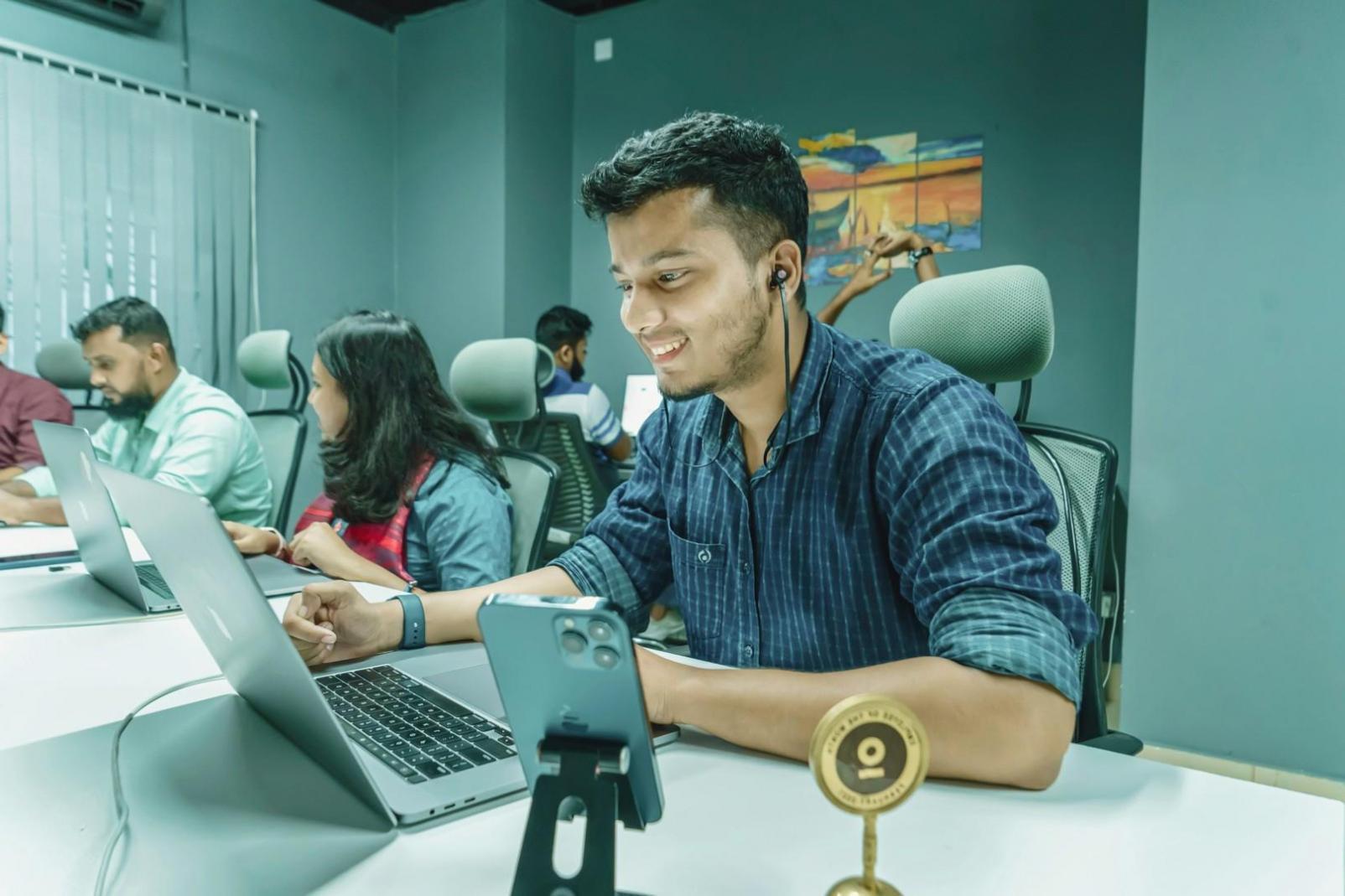 Programming workshop showing practical coding examples on screens